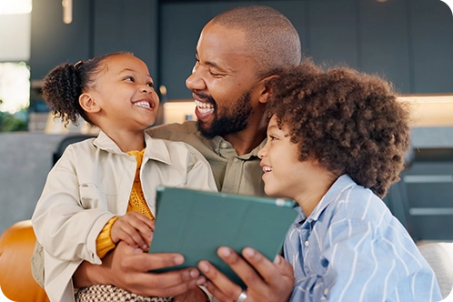 father holding daughter and son