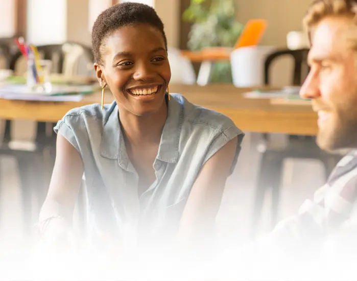 a woman smiling during conversation